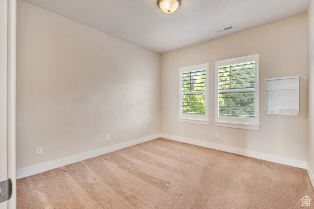 Empty room featuring carpet floors