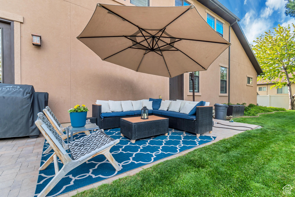 View of patio featuring area for grilling and outdoor lounge area