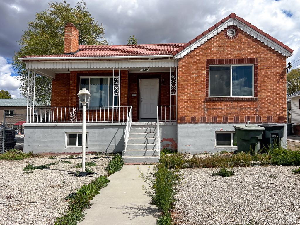 View of front of house with covered porch