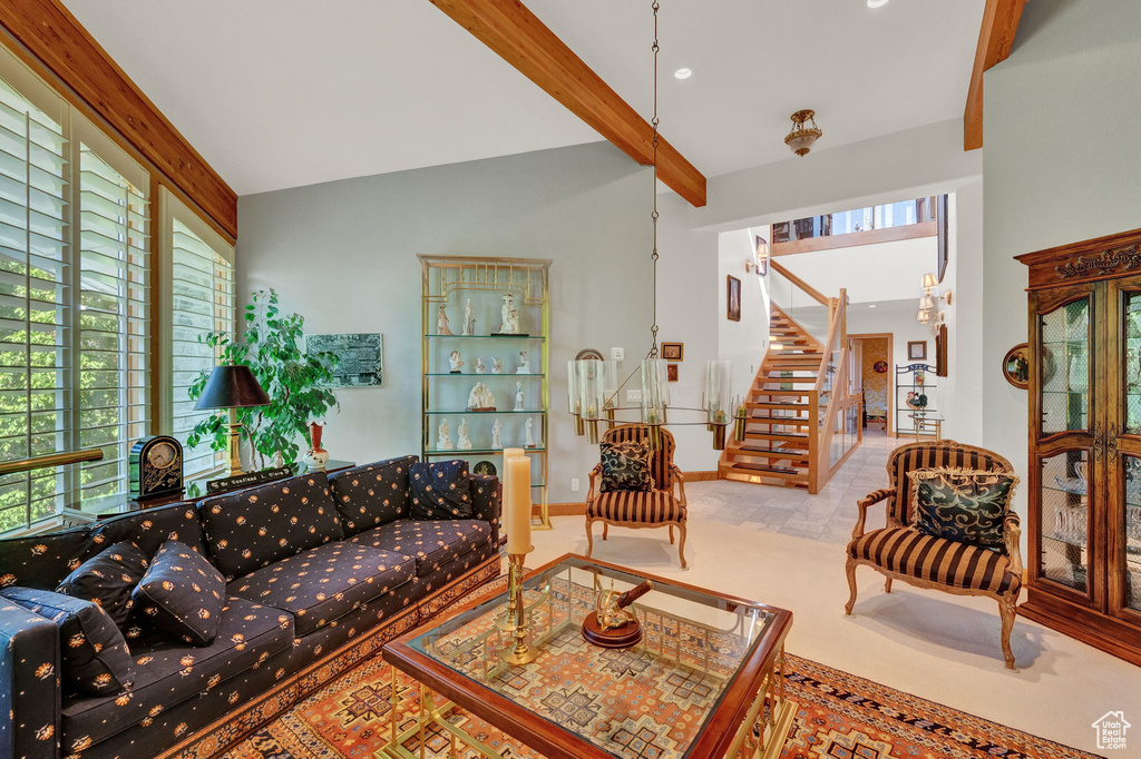 Tiled living room with beam ceiling and a wealth of natural light