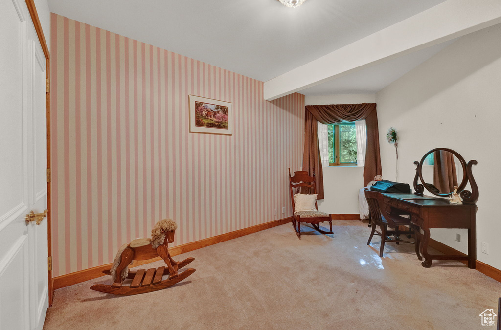 Home office with carpet flooring and beamed ceiling