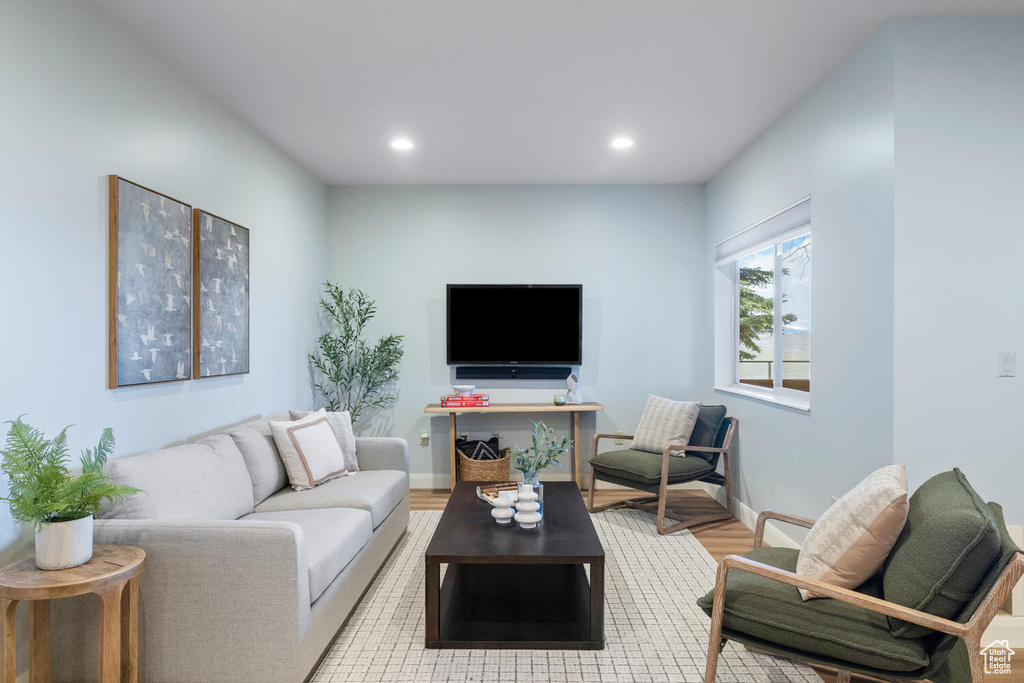 Living room with light wood-type flooring