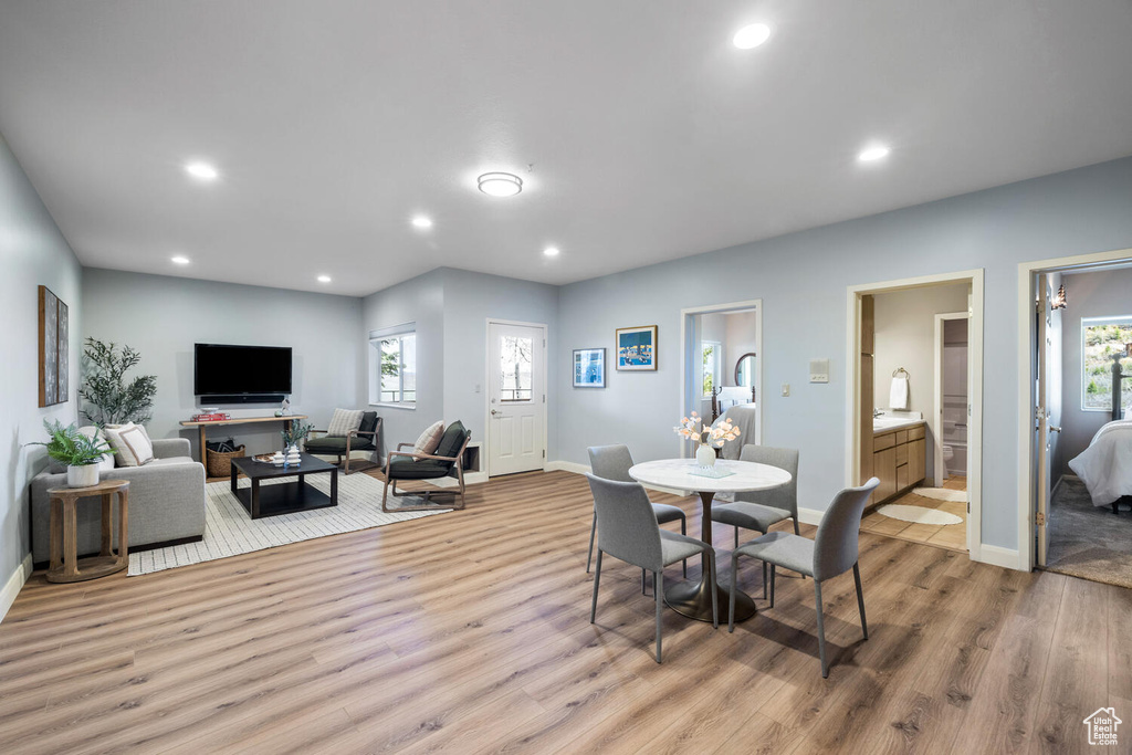 Dining room featuring a healthy amount of sunlight and hardwood / wood-style floors