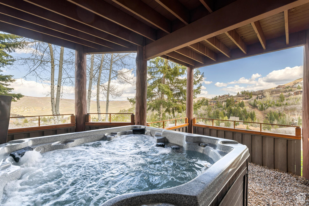 Exterior space with a hot tub