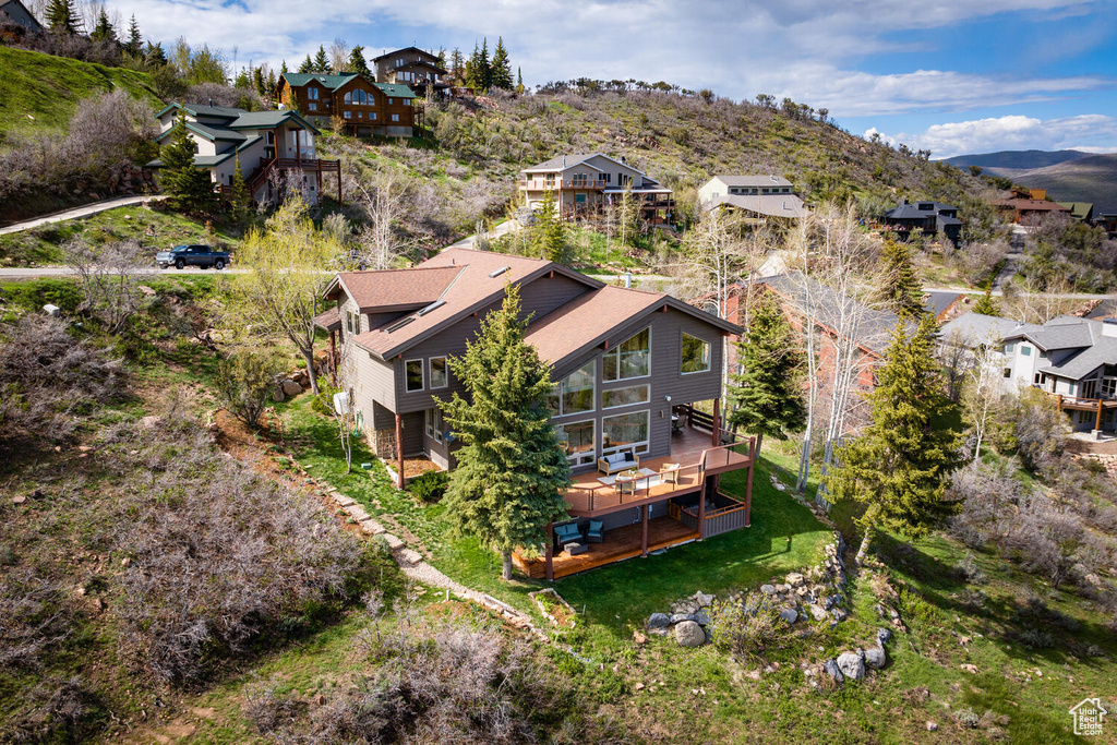 Birds eye view of property with a mountain view