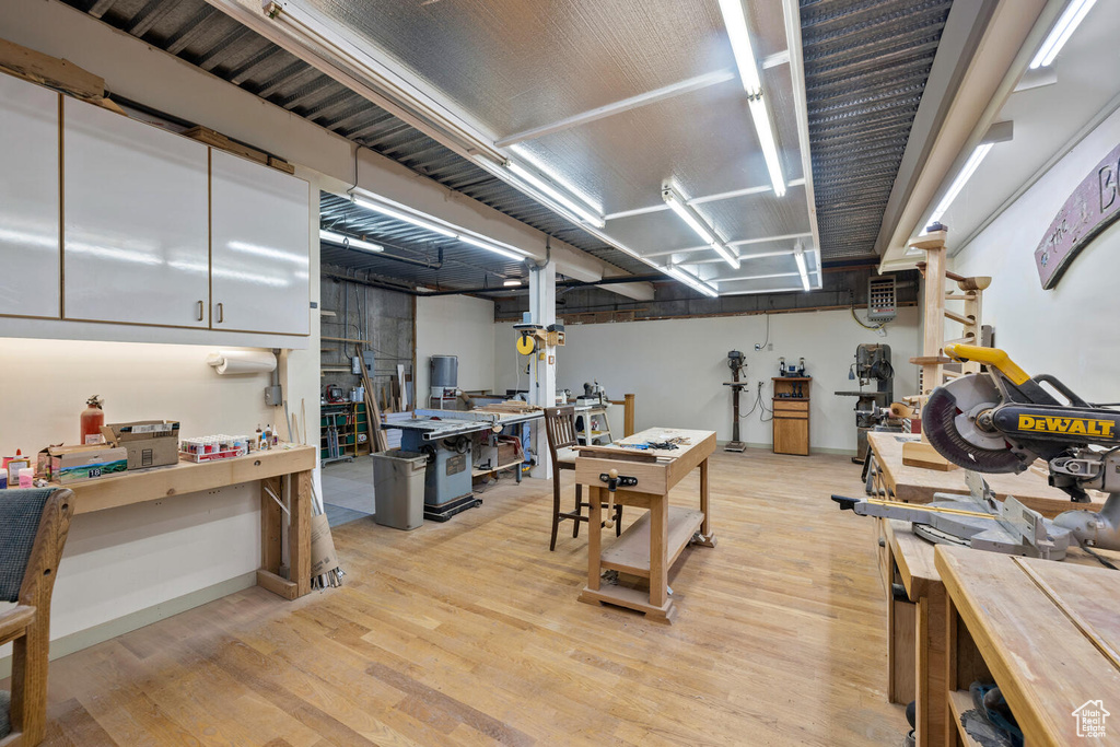 Interior space with light hardwood / wood-style floors and white cabinetry