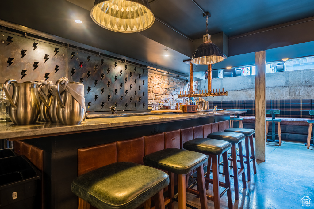 Bar featuring concrete floors