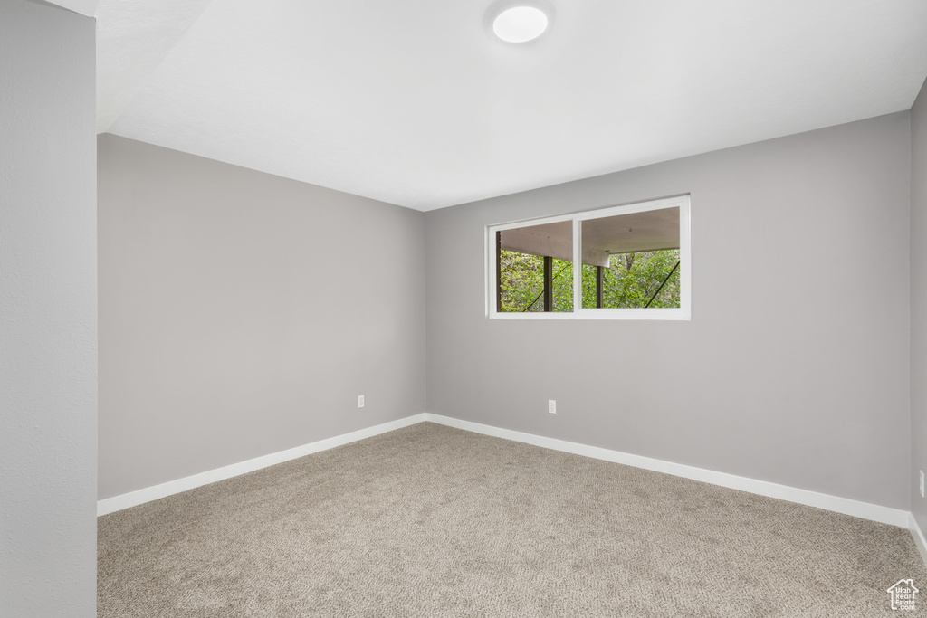 Unfurnished room featuring carpet flooring