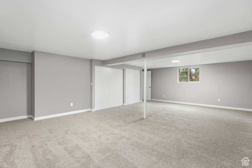 Basement with carpet flooring