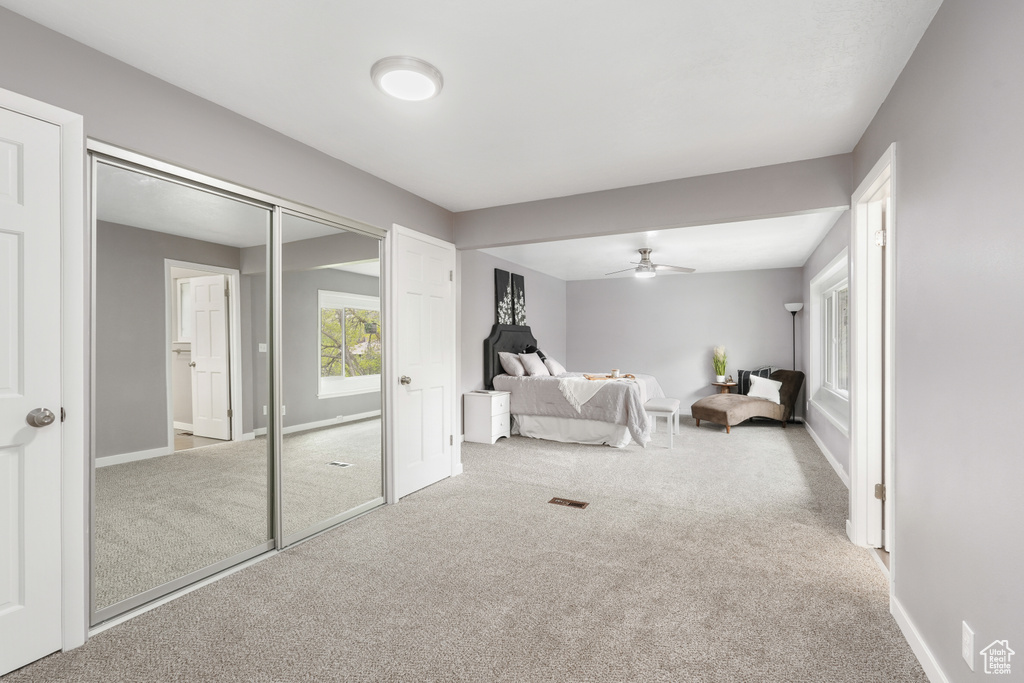 Interior space featuring carpet flooring and ceiling fan