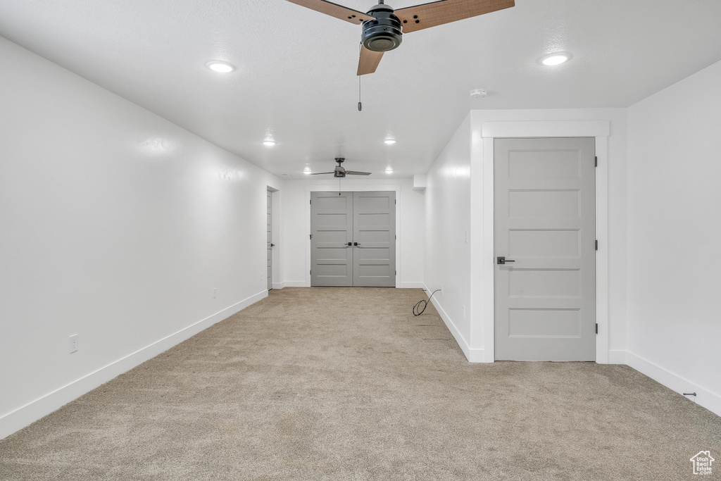 Garage featuring ceiling fan