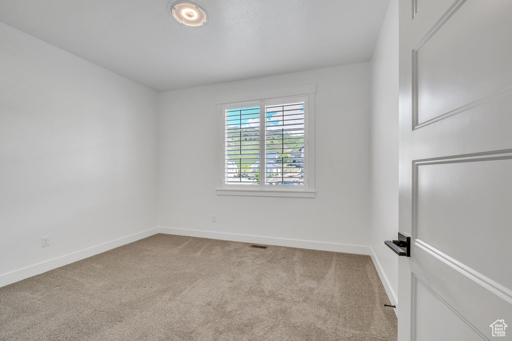 View of carpeted spare room