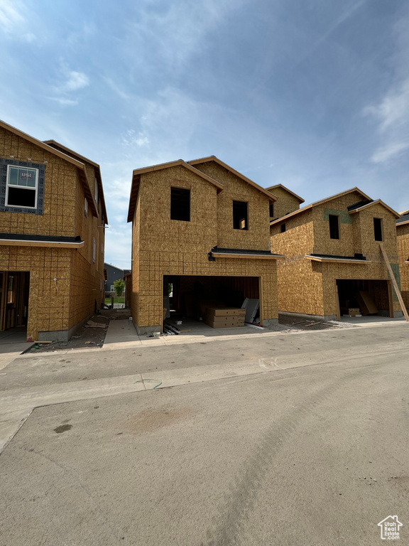 Property under construction with a garage