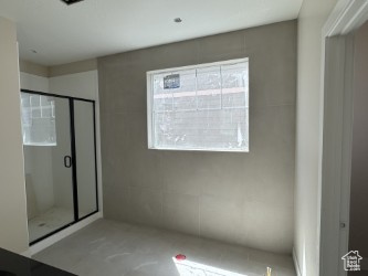 Full bath featuring a stall shower