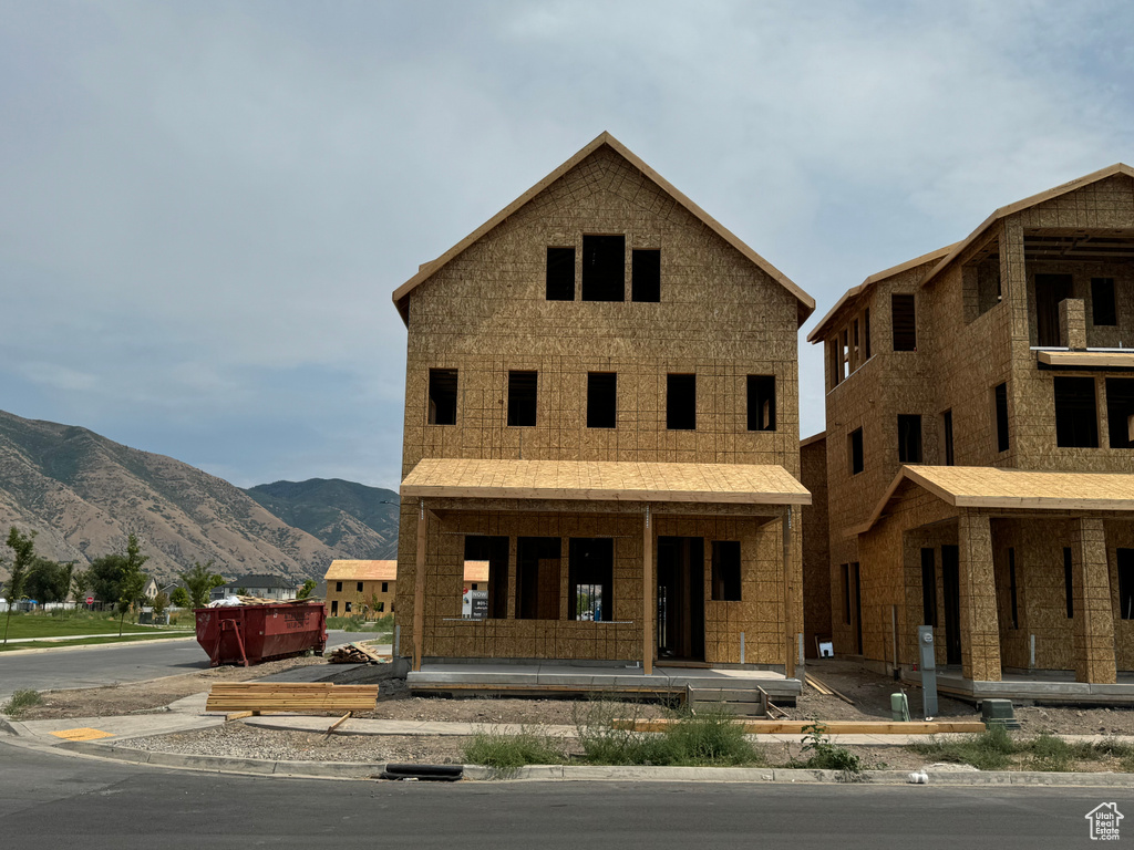 Unfinished property featuring a mountain view