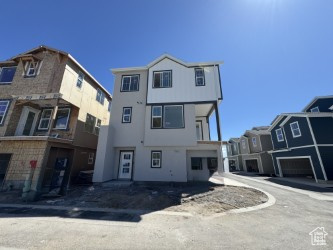 View of front of house featuring stucco siding