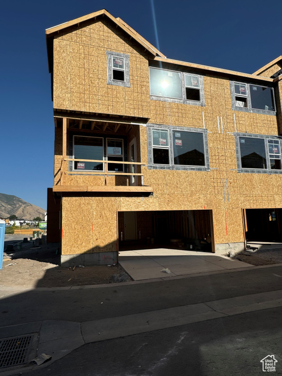 View of front of home featuring a mountain view