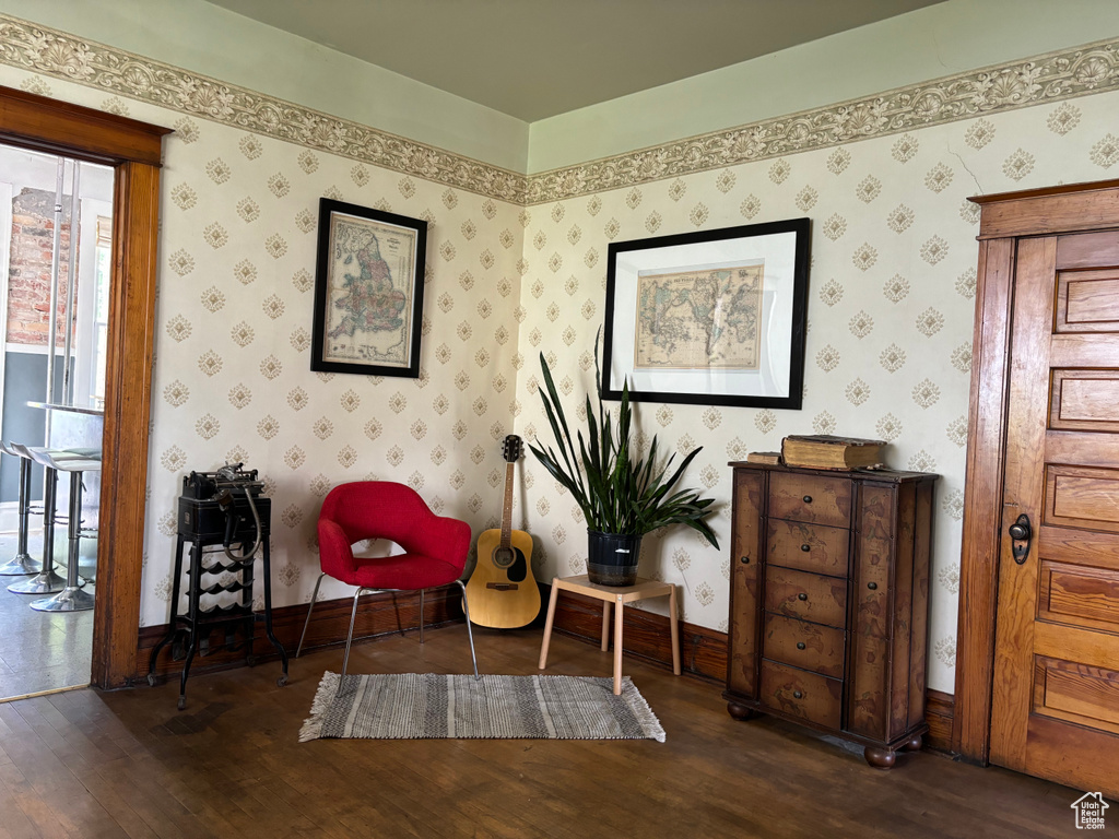 Sitting room featuring dark wood-type flooring