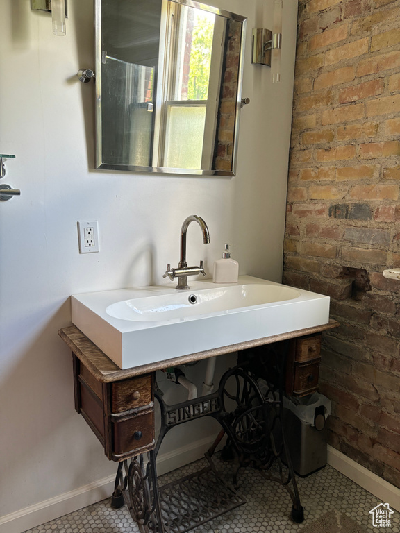 Bathroom with tile flooring and large vanity