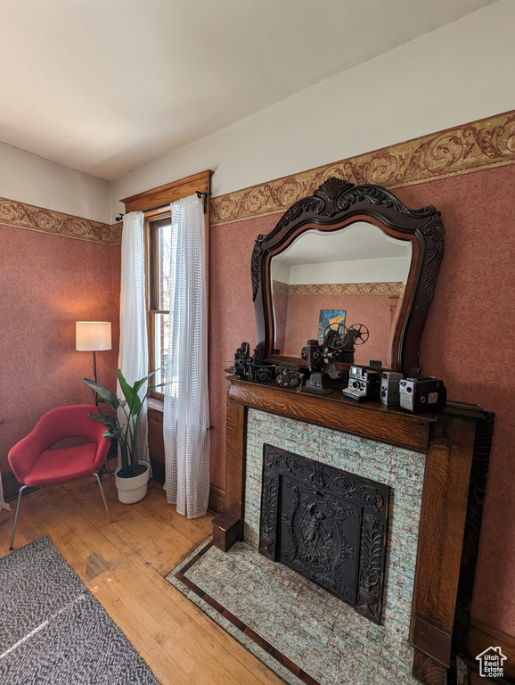 Living room featuring hardwood / wood-style floors and a fireplace