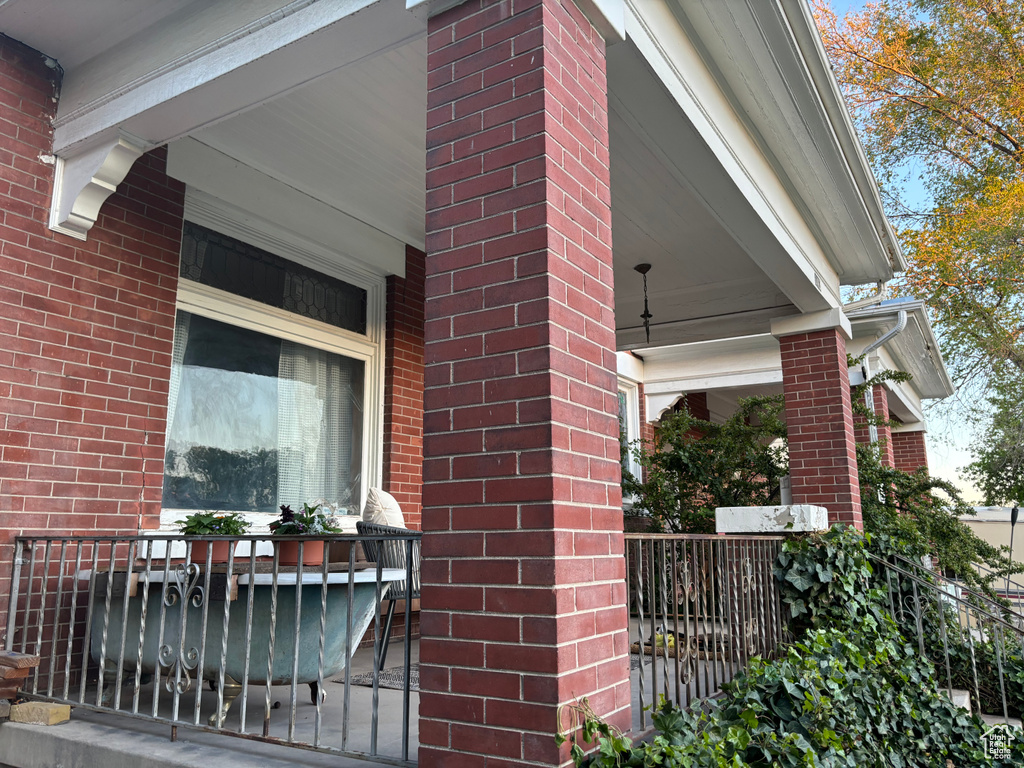 View of property exterior featuring a porch