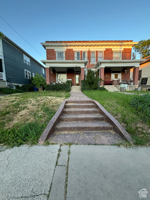 View of front of home with central air condition unit