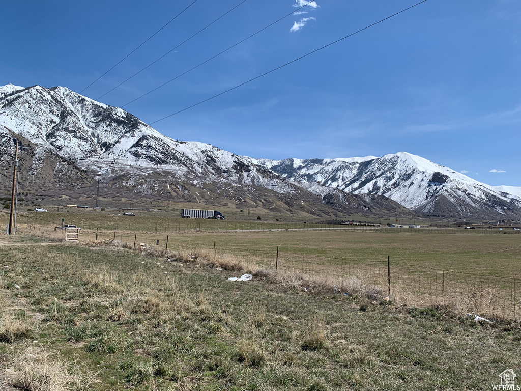 Property view of mountains with a rural view