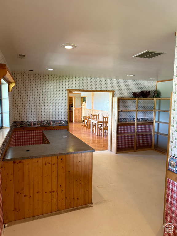 Kitchen featuring concrete floors