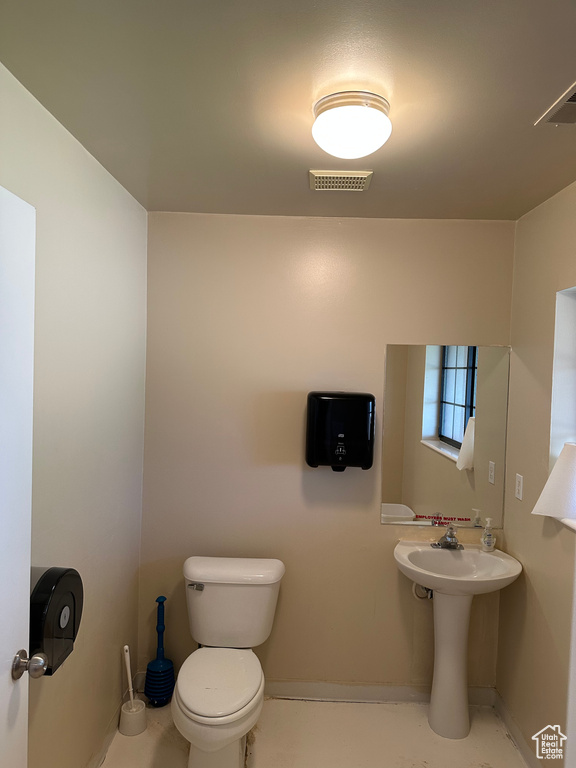 Bathroom with tile flooring and toilet