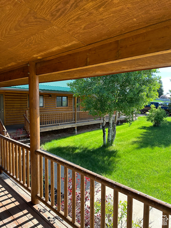 Deck featuring a lawn