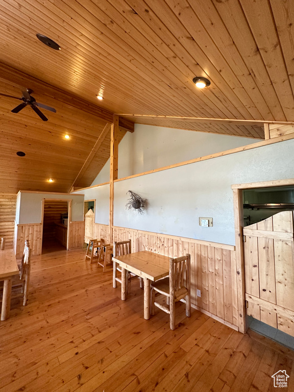 Dining room featuring wooden ceiling, ceiling fan, lofted ceiling, and wood-type flooring