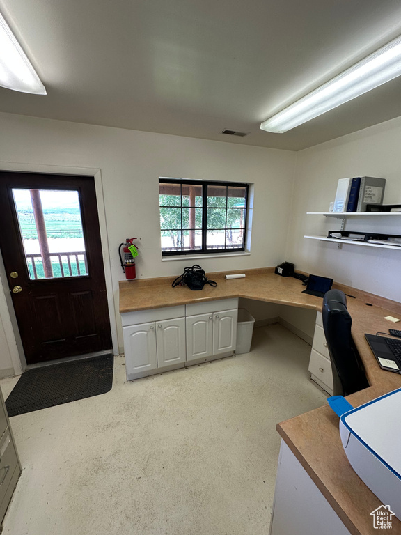 Office area featuring plenty of natural light