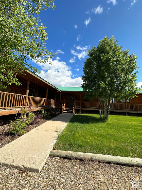 Exterior space featuring a front lawn