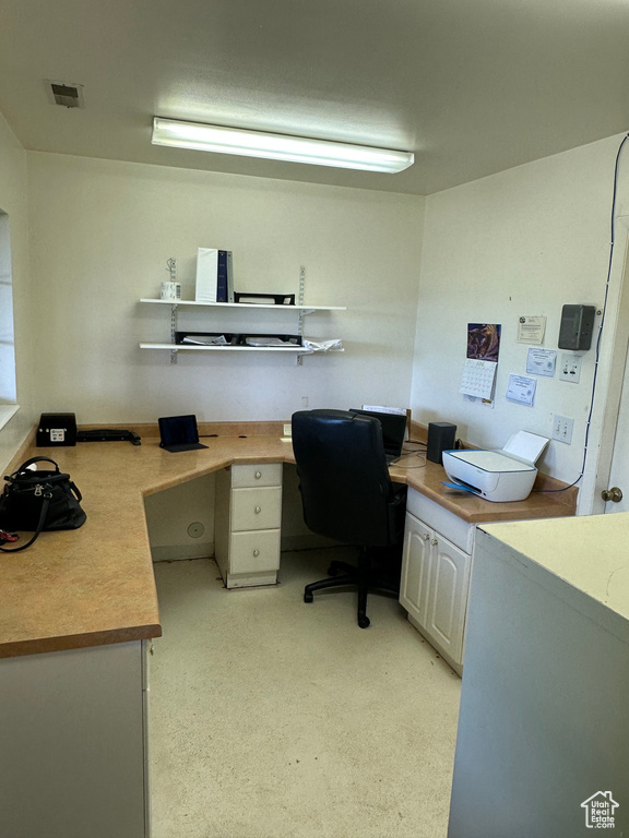 Office space featuring built in desk