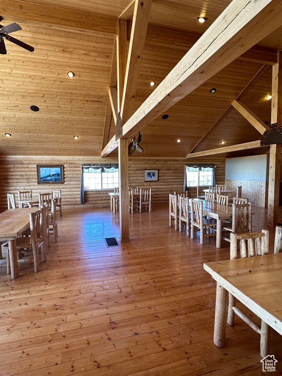 Dining room with a healthy amount of sunlight, hardwood / wood-style floors, ceiling fan, and wood ceiling