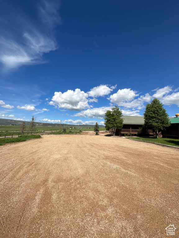 View of yard with a rural view