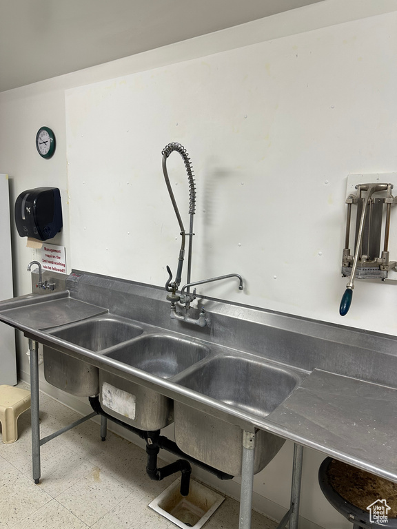 Interior details featuring sink and tile floors