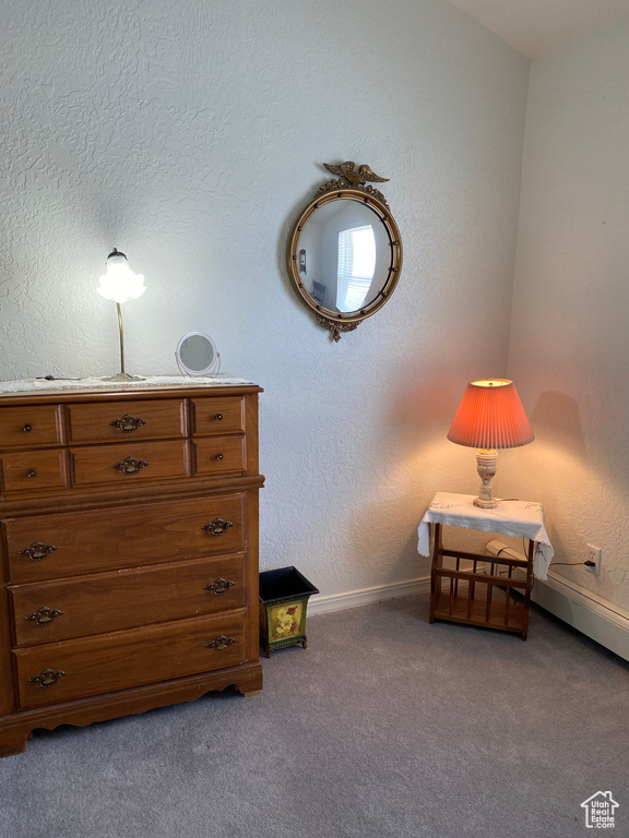 Sitting room featuring carpet floors