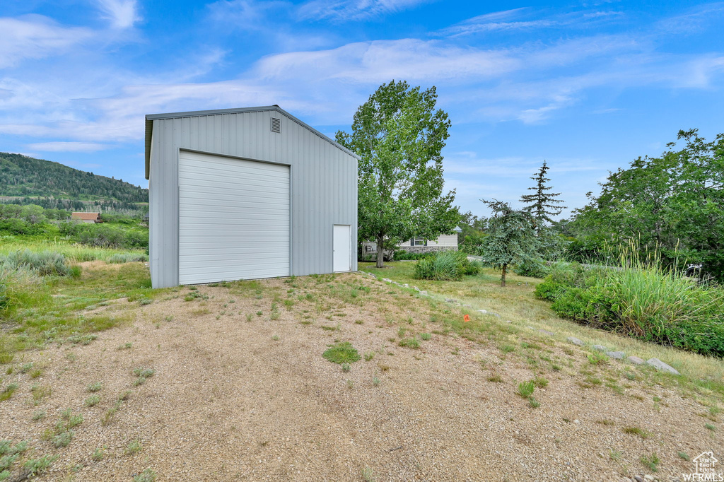 Exterior space featuring a garage and a mountain view