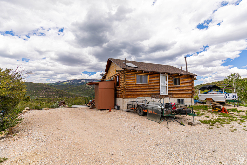 View of side of property featuring a mountain view