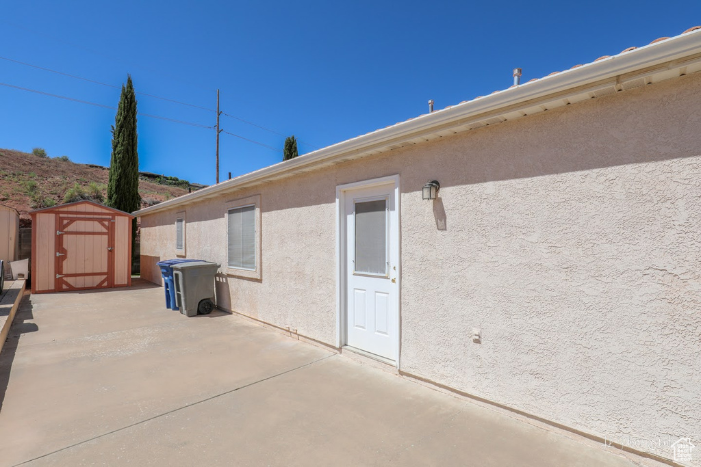 View of terrace with a storage shed