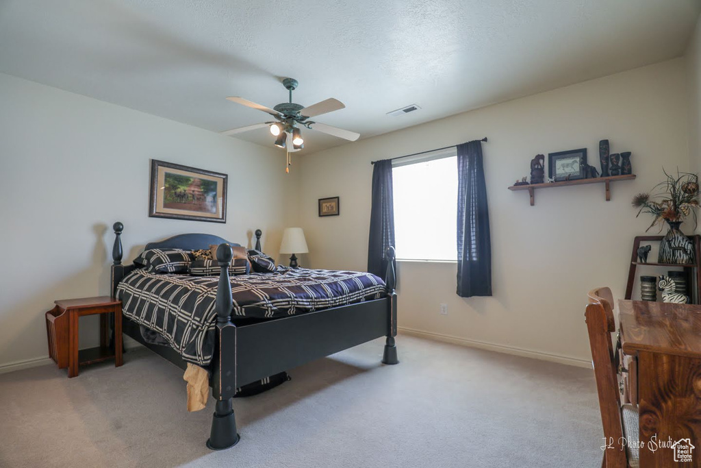 Bedroom featuring carpet and ceiling fan