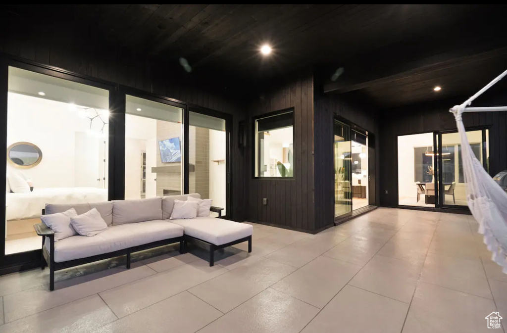 Patio terrace at twilight featuring outdoor lounge area