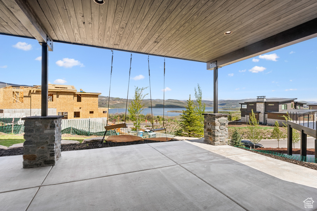 View of terrace with a water view