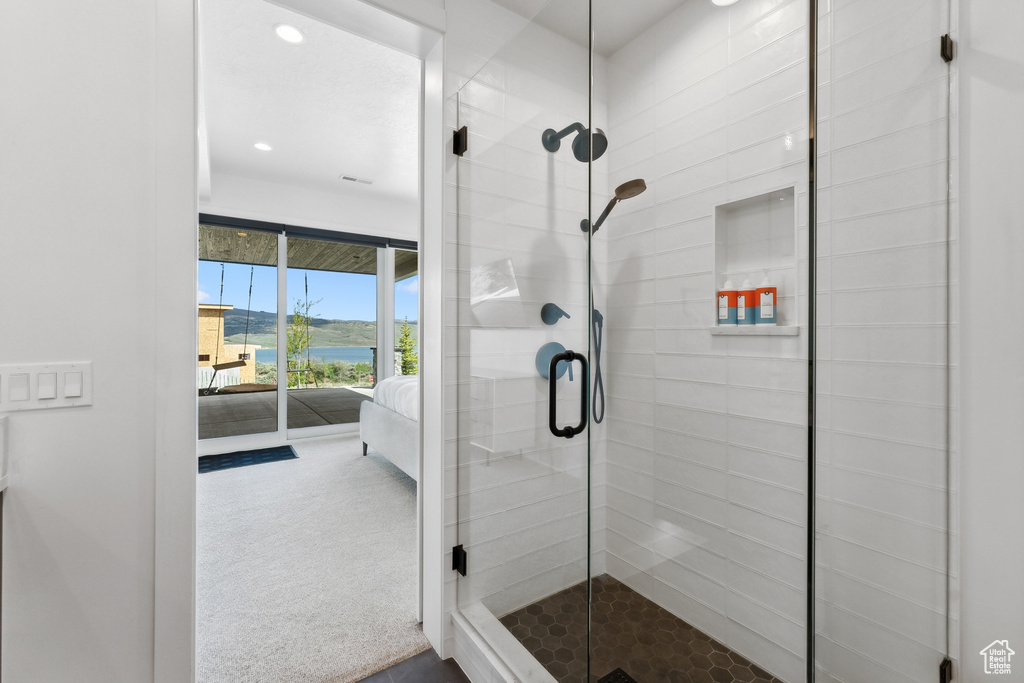 Bathroom with a shower with door