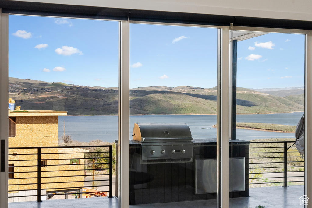 Interior space featuring a water and mountain view