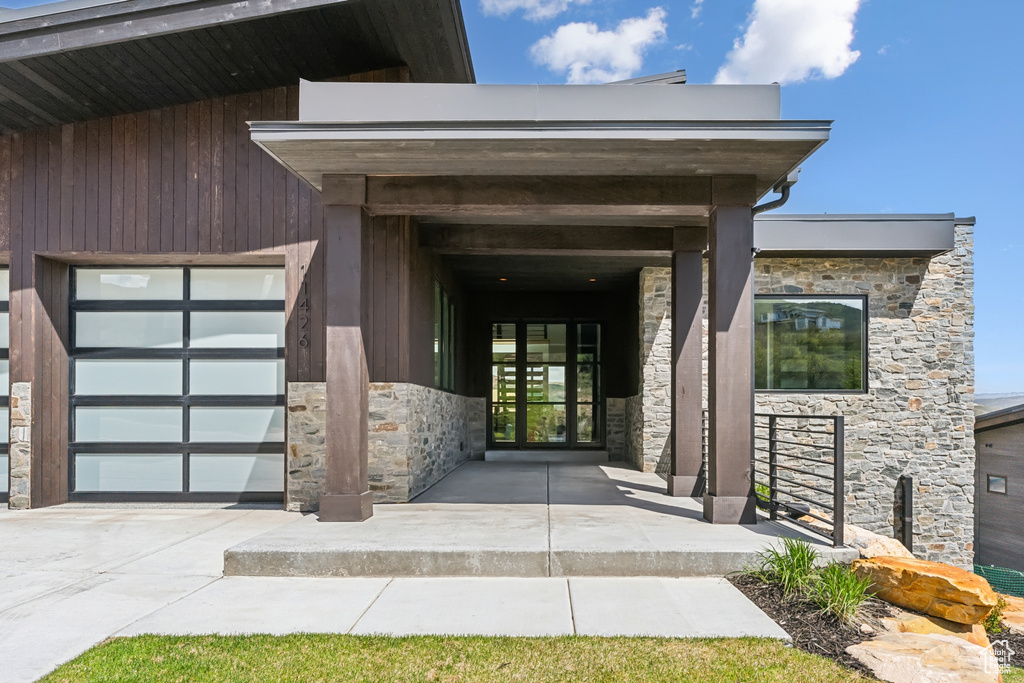 Doorway to property featuring a garage