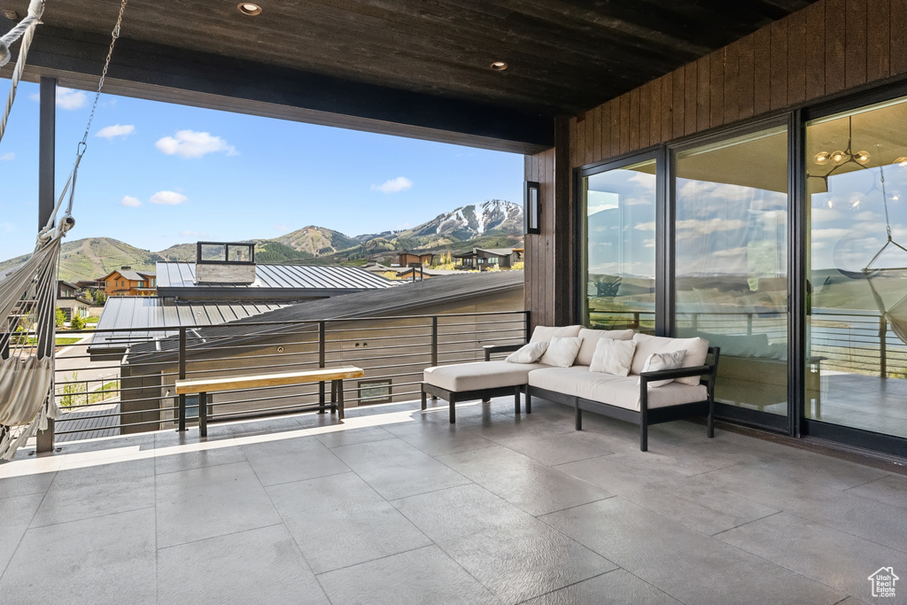 View of patio featuring a mountain view and a balcony