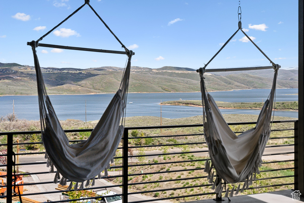 Exterior space featuring a water and mountain view