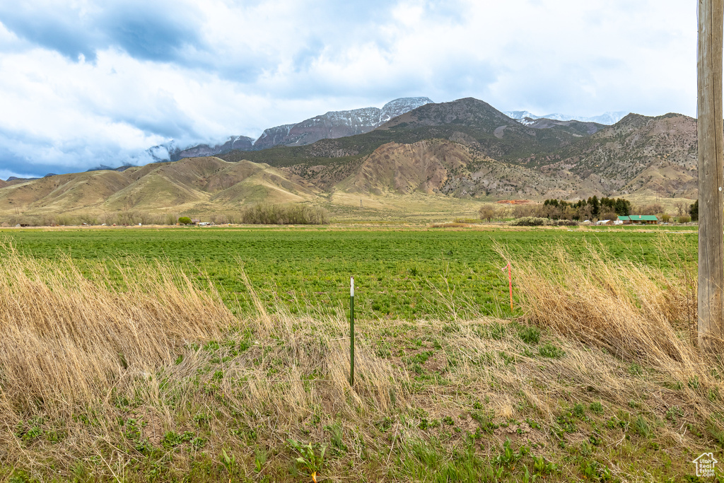 Property view of mountains with a rural view